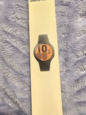 Samsung Galaxy Watch 4 with Black Band and A Vivid 44mm Watch Face